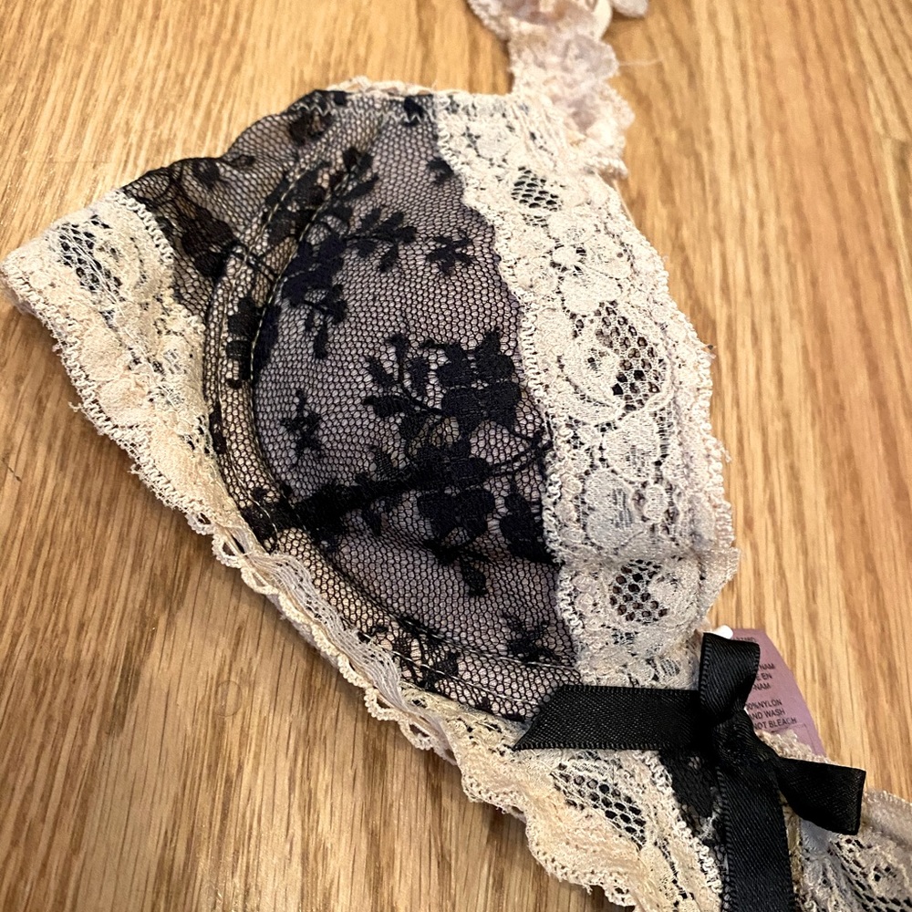 Cream and black lace lingerie bra